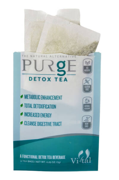 Purge Detox Tea package with two tea bags sticking out of the top of open bag.
