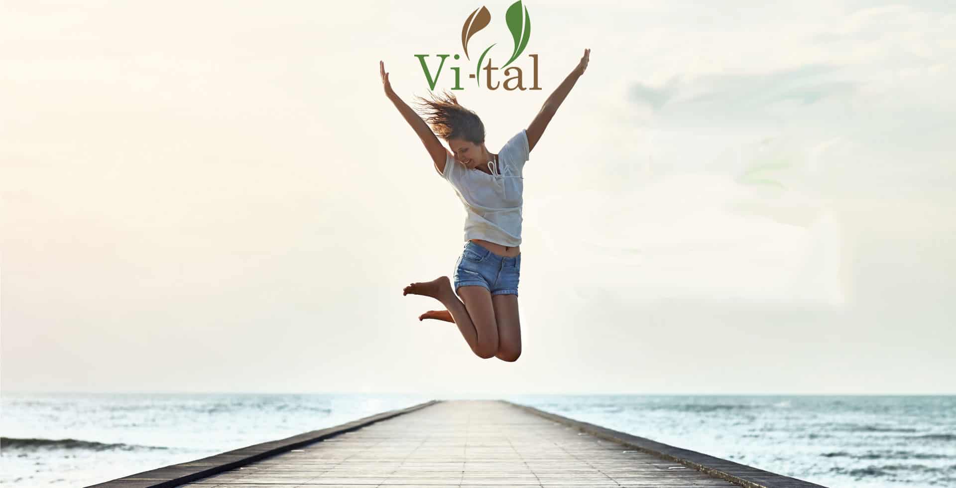 Woman jumping up in the air with arm up, very happy